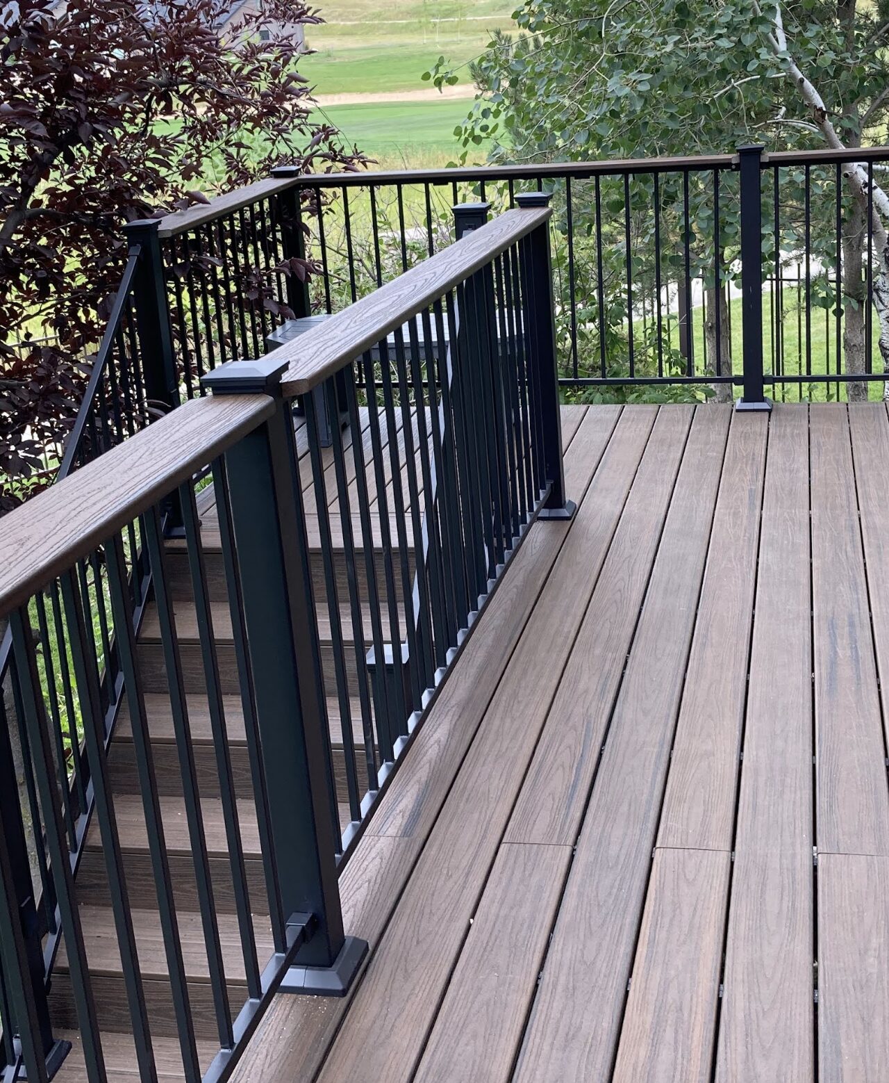 Composite deck overlooking a landscaped yard